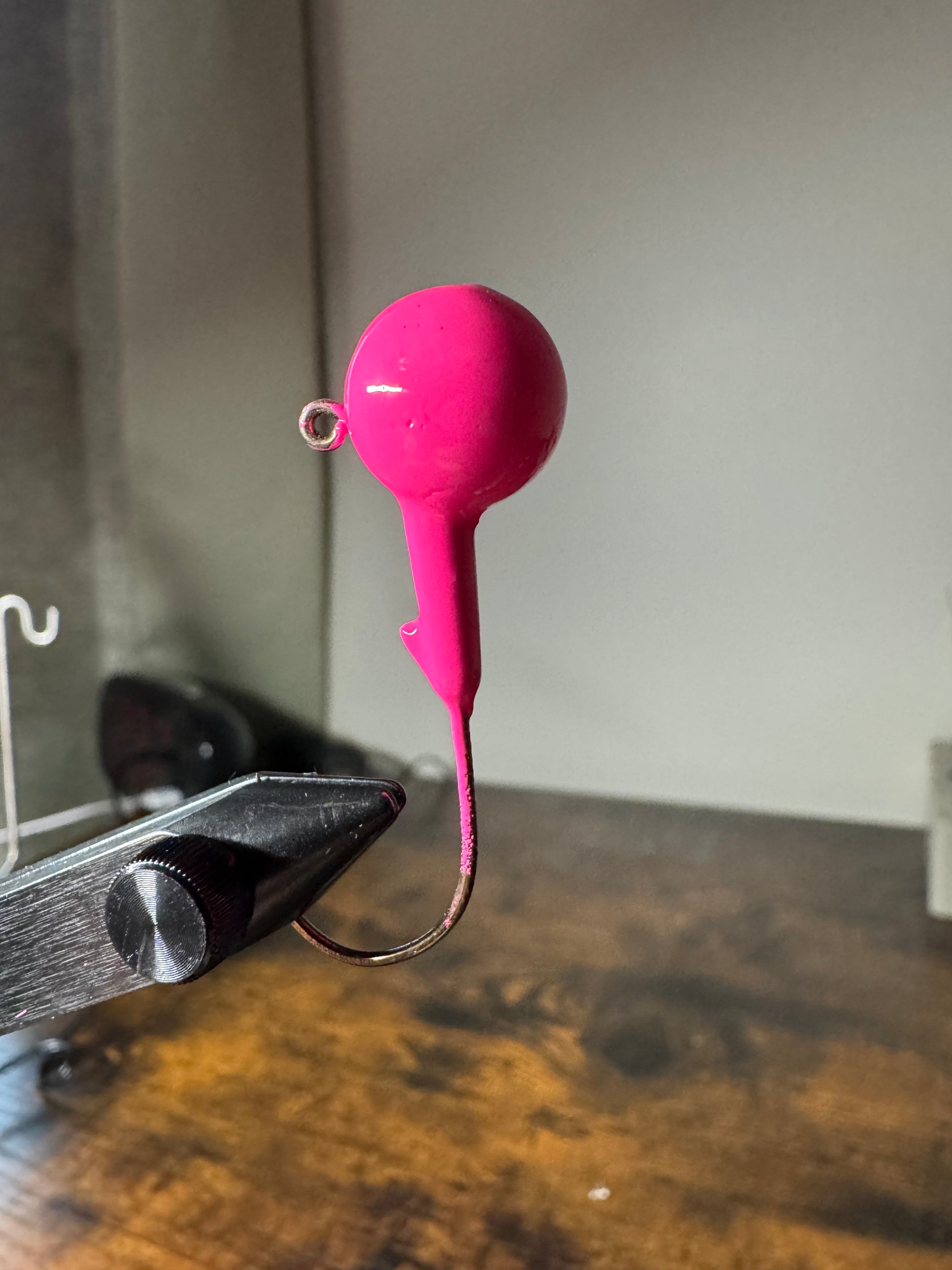Bright hot pink lead free jig for bass and walleye with bait keeper and clean hook eye