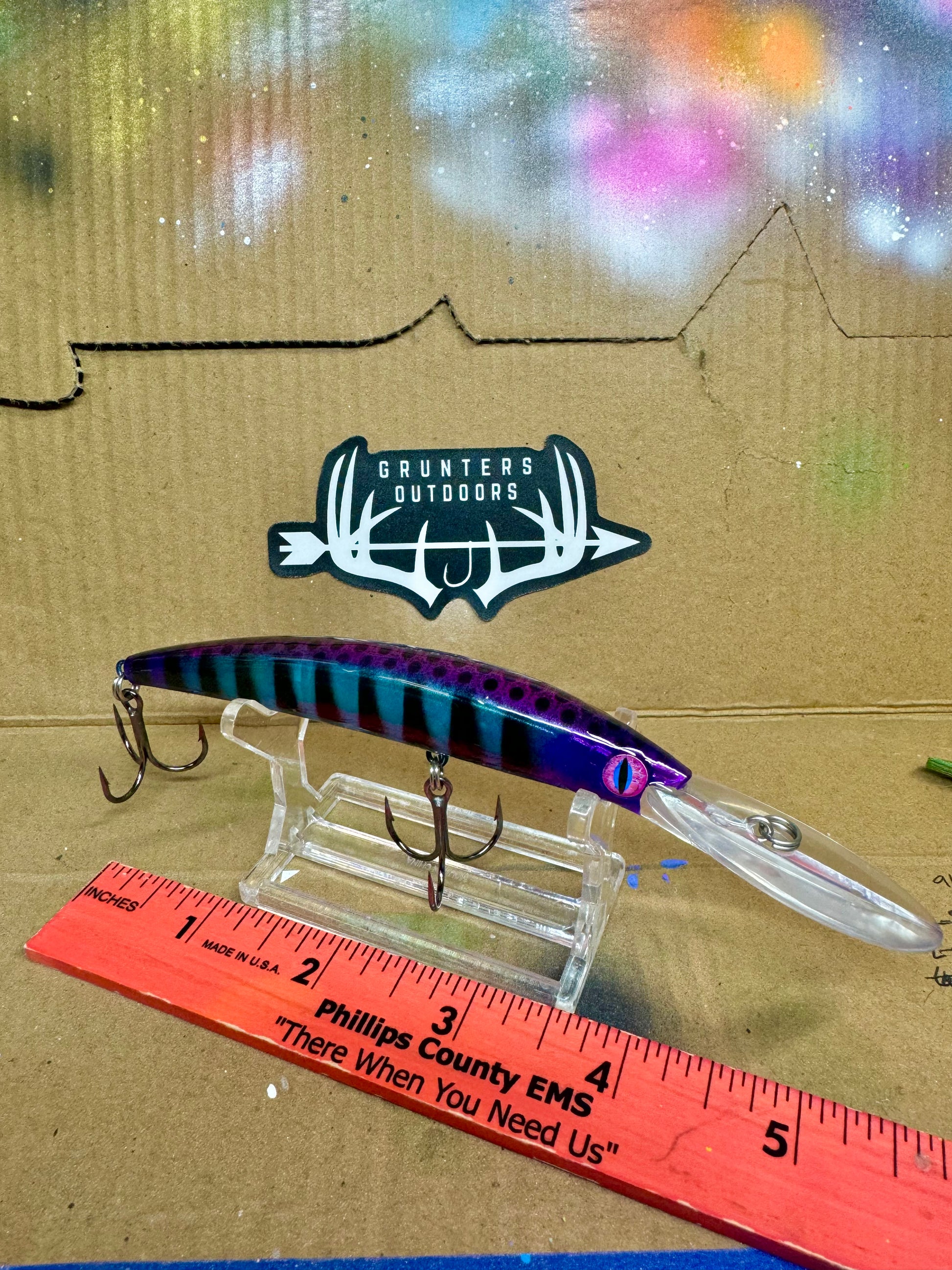 Walleye deep diver lure with heavy duty hooks that is cotton candy colored with blue pink and purple